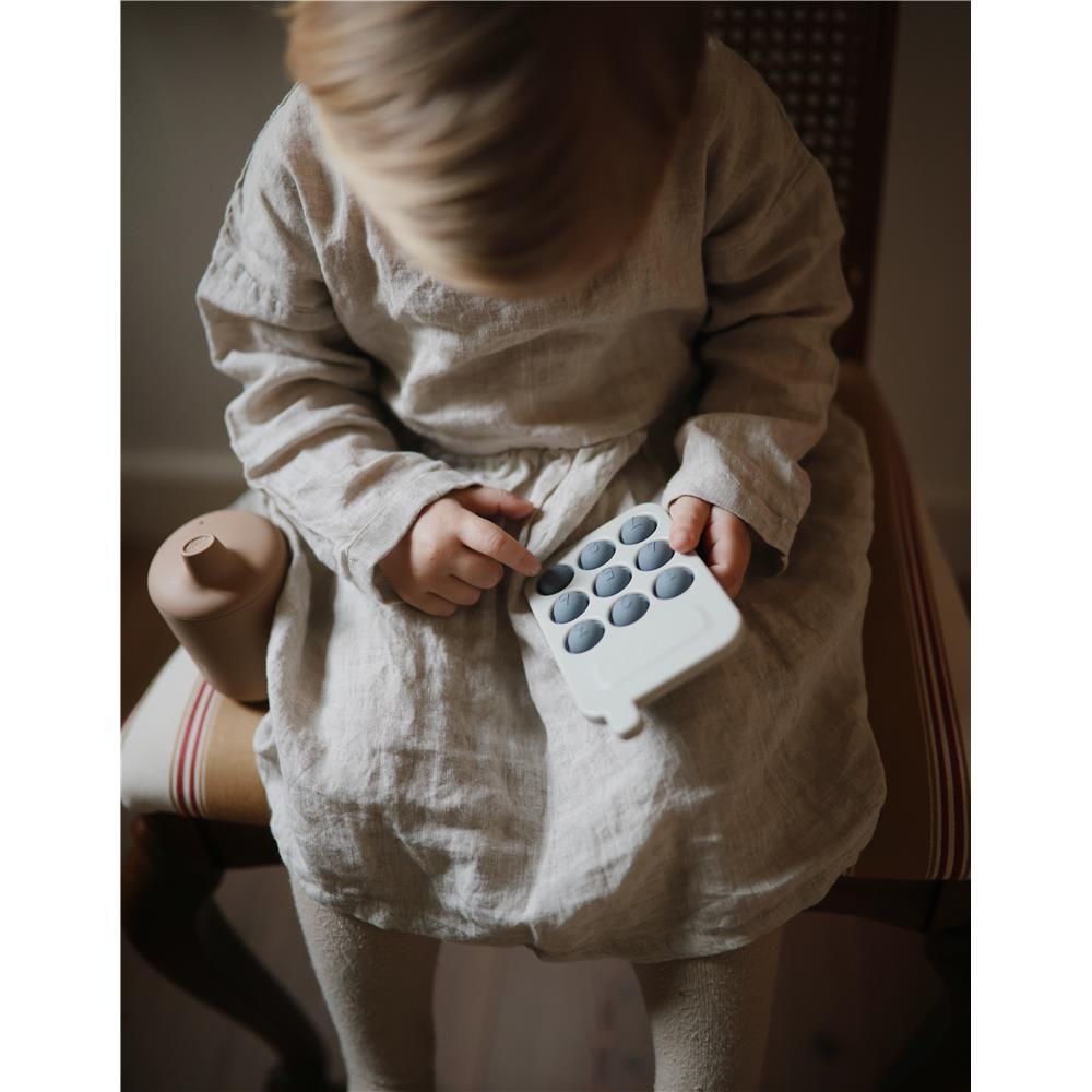 Mushie Sensorik-Spielzeug Telefon, Tradewinds, aus Silikon, BPA-frei